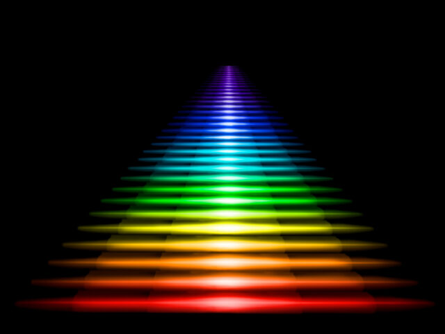 Multi-colored luminous staircase on a black background